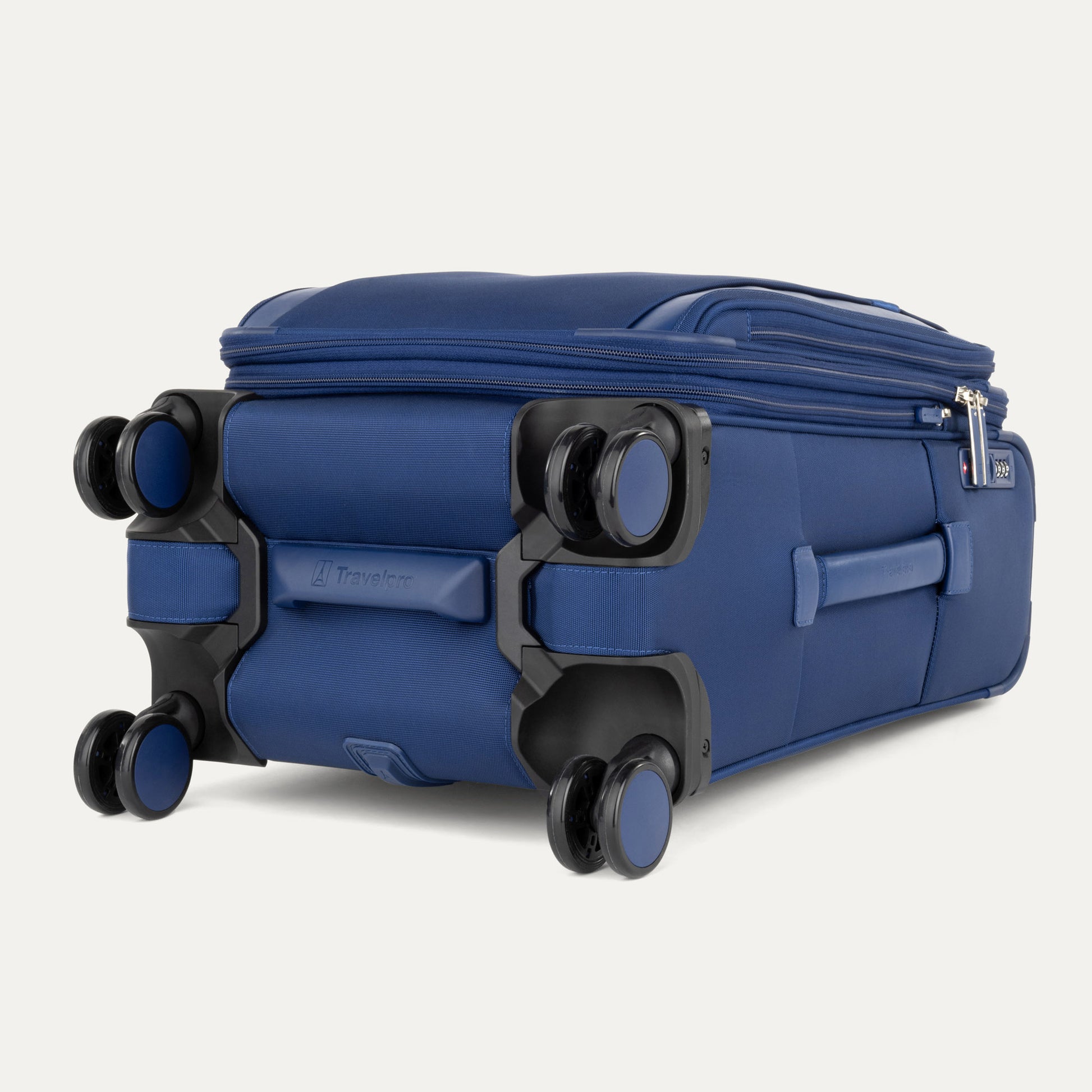 The Travelpro® VersaPack®+ Carry-on Spinner shows its four dual wheels and zippered compartments.