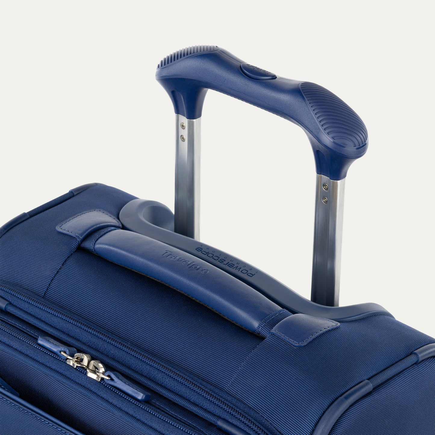 Close-up of the Travelpro® VersaPack®+ Carry-on Expandable Spinner with extended handle and zipper pocket.