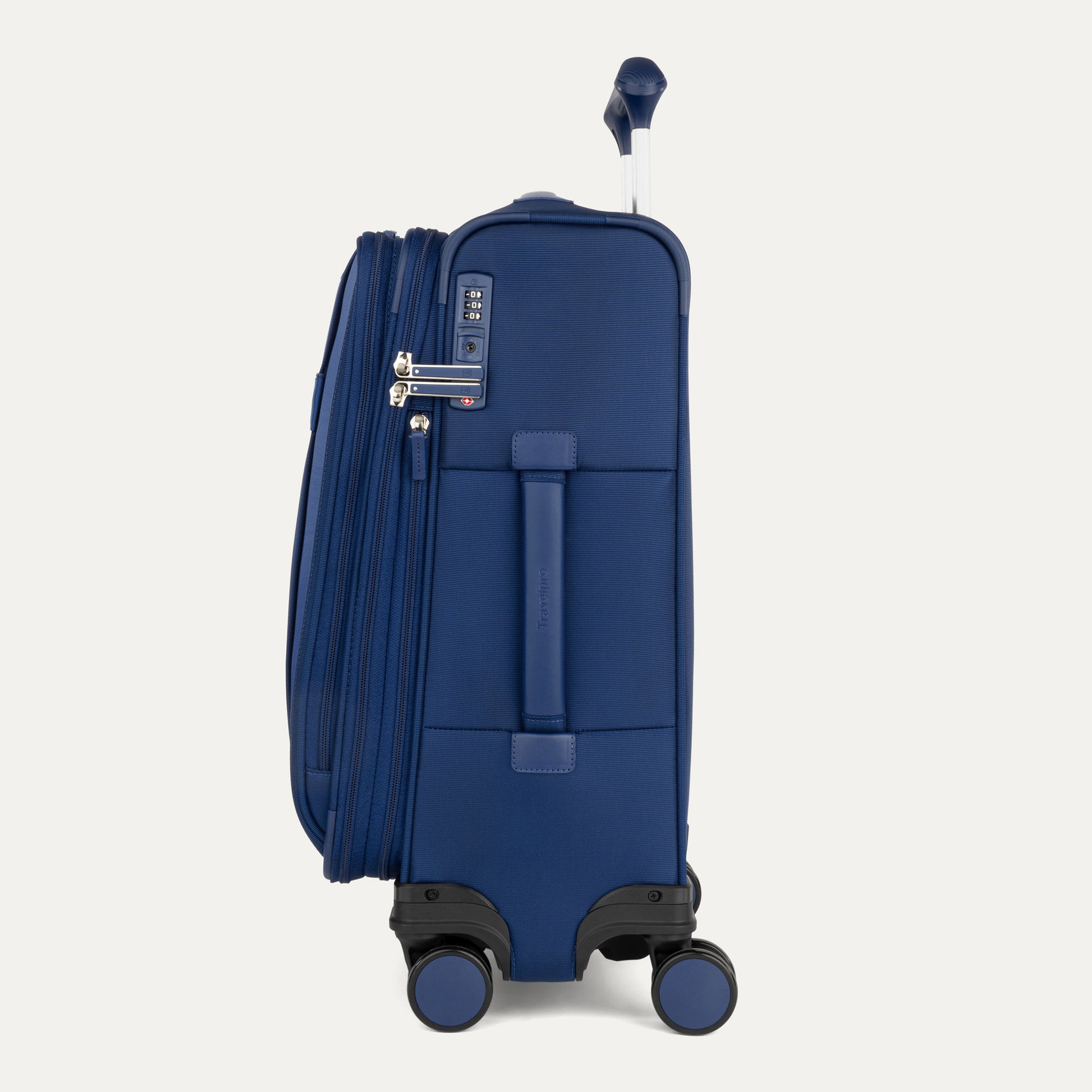Travelpro VersaPack+ blue carry-on expandable spinner with TSA lock and extended zipper, side view.