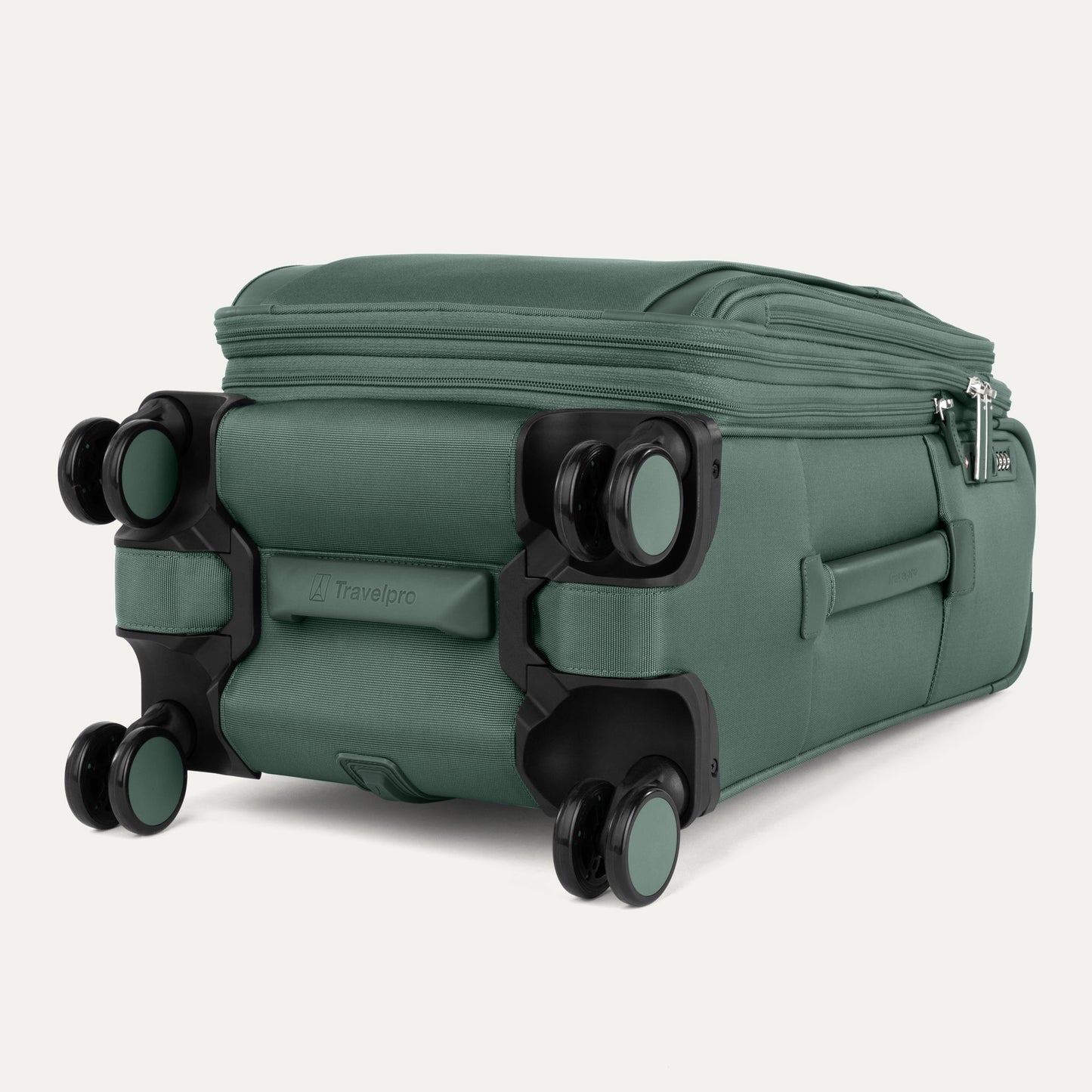 The Travelpro® VersaPack®+ green carry-on spinner shows four wheels and zippered compartments.