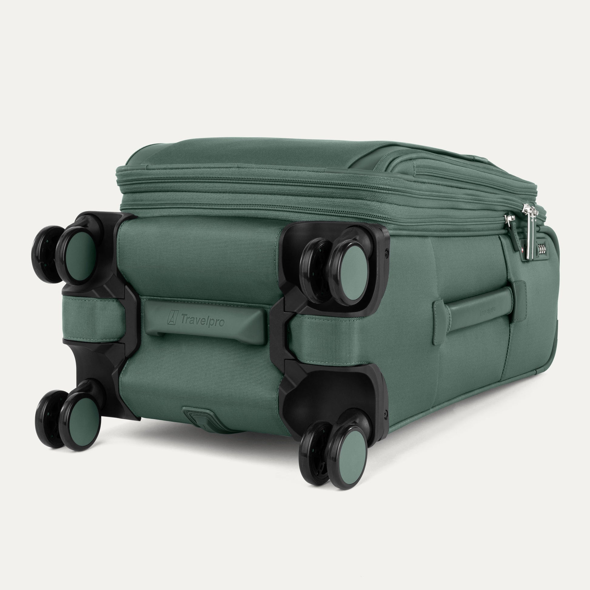 The Travelpro® VersaPack®+ green carry-on spinner shows four wheels and zippered compartments.