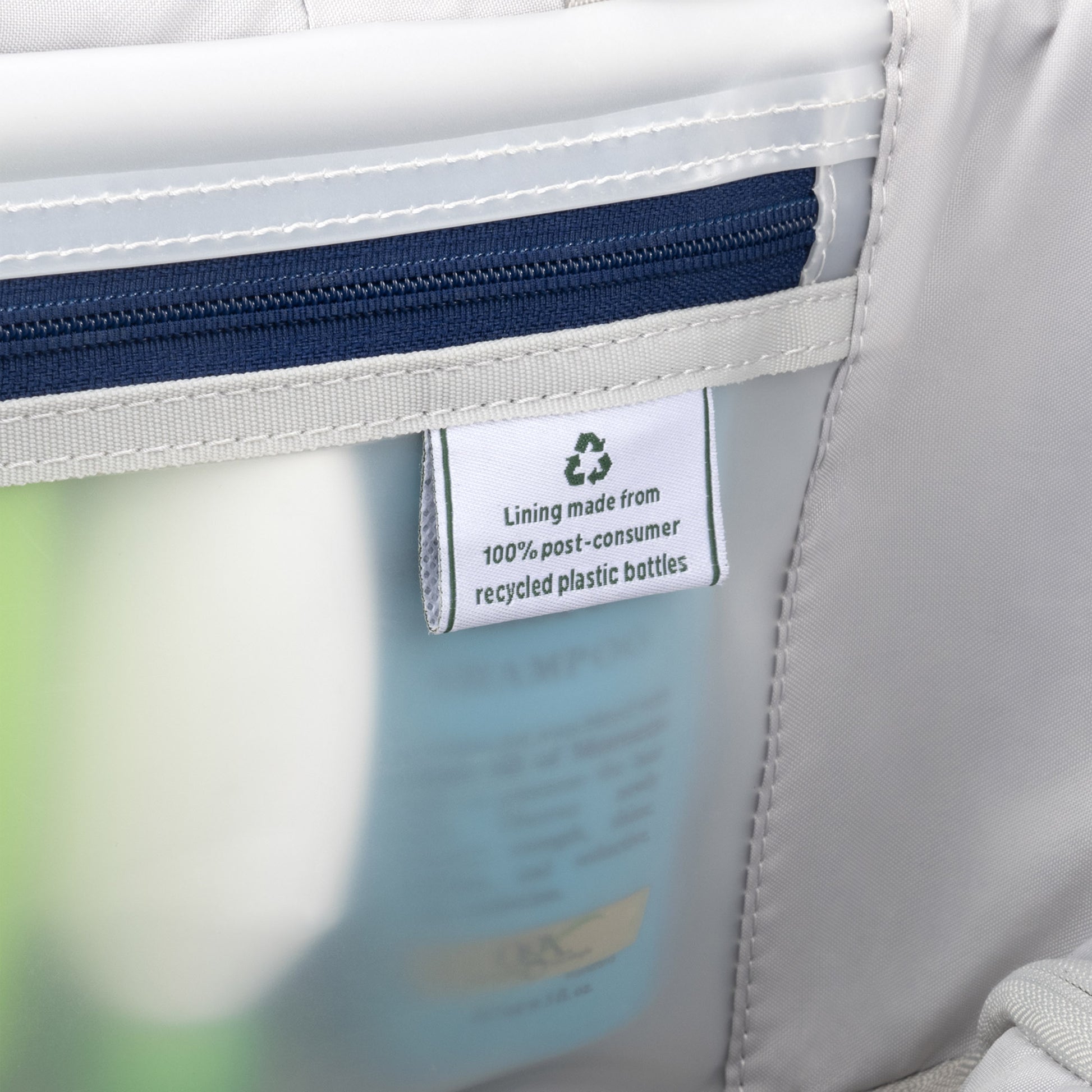 Close-up of inner pocket with label in the Travelpro® VersaPack®+ Compact Carry-on Expandable Spinner.