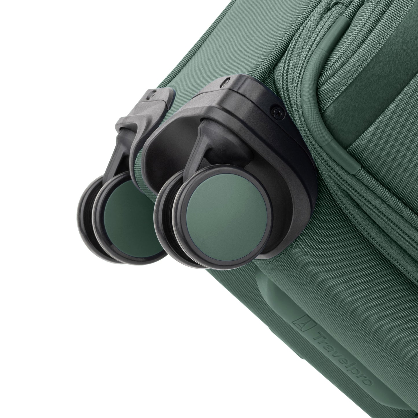 Close-up of the Travelpro® VersaPack®+ Compact Carry-on Expandable Spinner with green and black wheels.