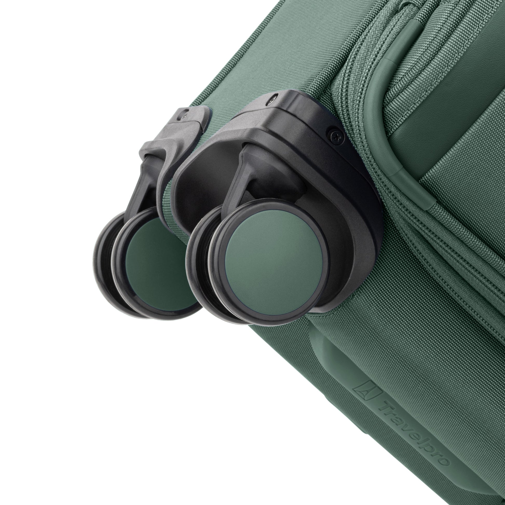 Close-up of the Travelpro® VersaPack®+ Compact Carry-on Expandable Spinner with green and black wheels.