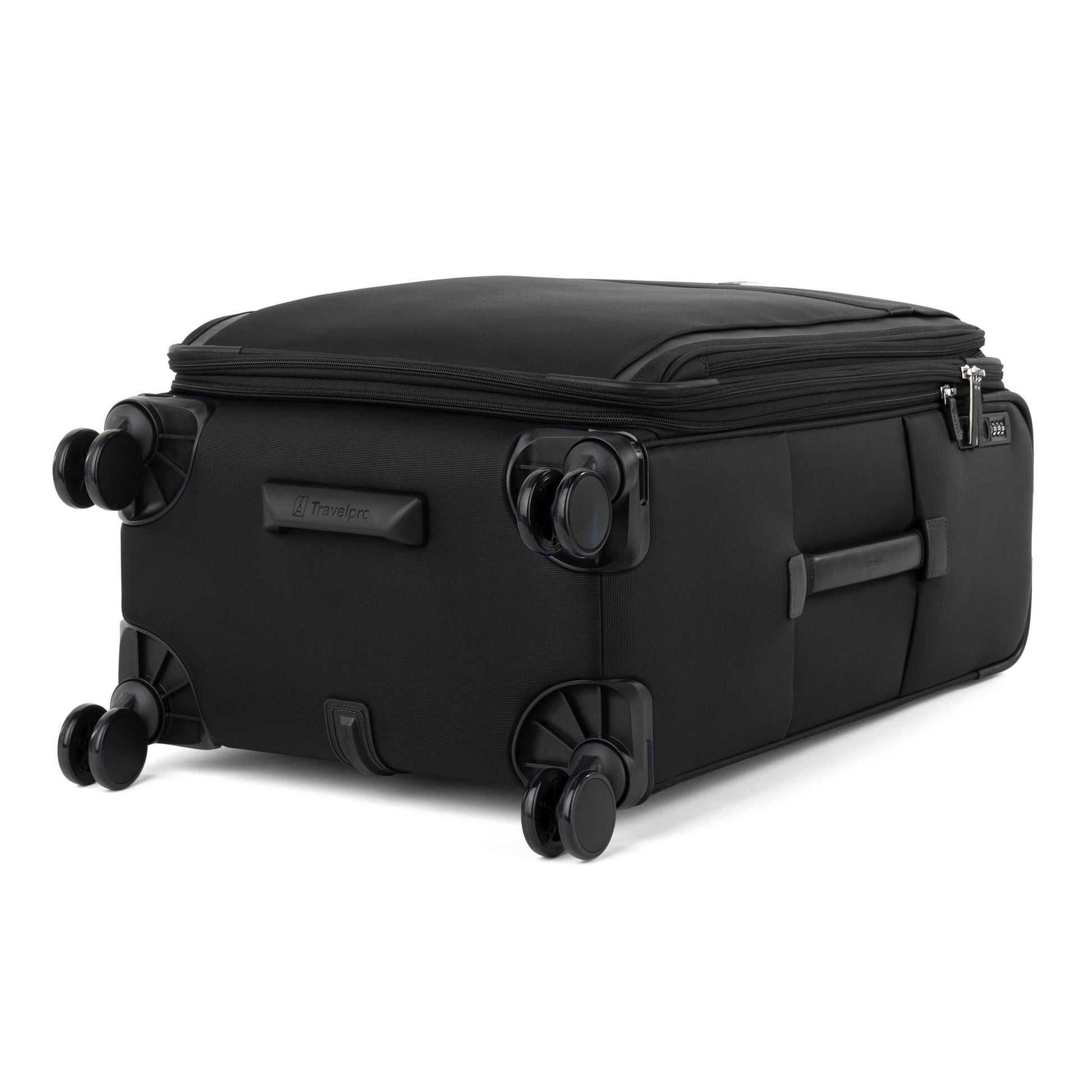 Travelpro VersaPack+ medium expandable spinner with double wheels, side handle, and water-resistant lining.