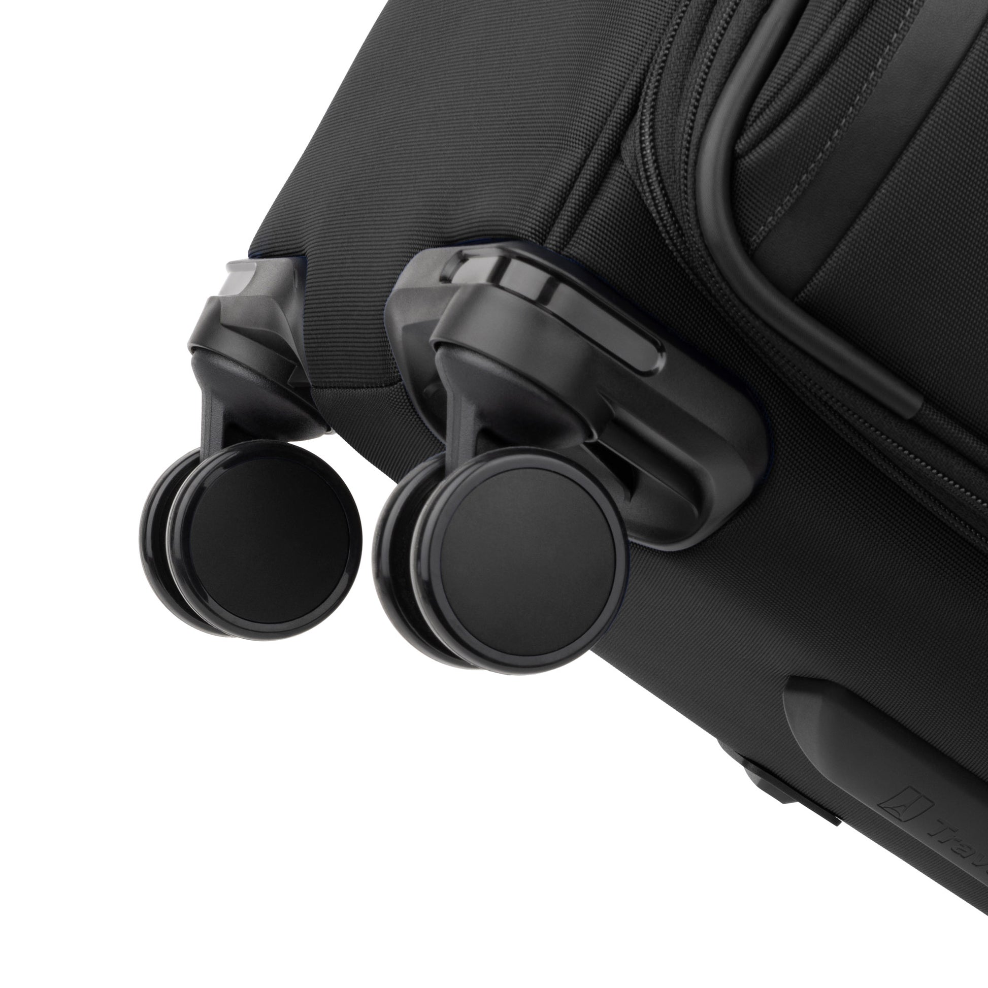 Close-up of two black wheels on the Travelpro® VersaPack®+ Medium Check-in Expandable Spinner with water-resistant lining.
