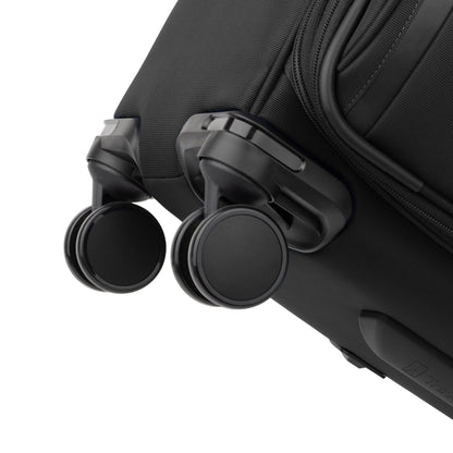 Close-up of two black wheels on the Travelpro® VersaPack®+ Medium Check-in Expandable Spinner with water-resistant lining.