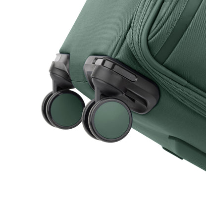 Close-up of two green wheels on the Travelpro VersaPack+ Medium Check-in Expandable Spinner.
