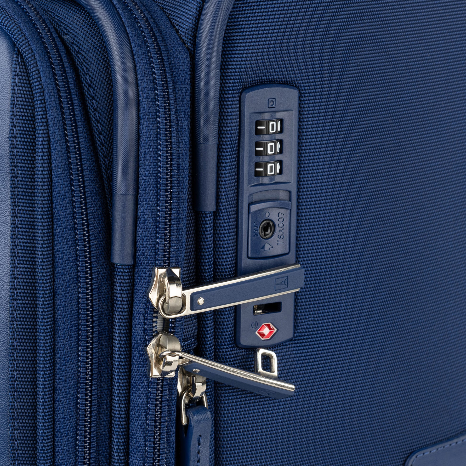 Close-up of Travelpro® VersaPack®+ Large Spinner: blue, with TSA lock and secure zipper pulls.