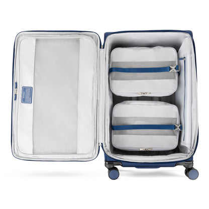 Keep your Travelpro® VersaPack®+ luggage organized with two gray packing cubes shown in an open suitcase.