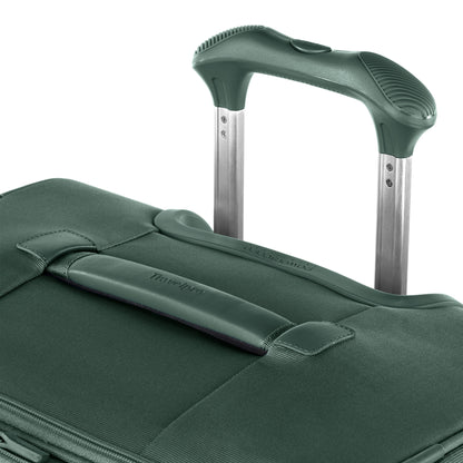 Close-up of the Travelpro® VersaPack®+ Large Spinner, featuring an extended telescopic and fabric carry handle.