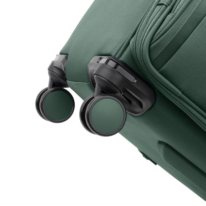 Close-up of black and green wheels on the Travelpro® VersaPack®+ Large Check-in Expandable Spinner.