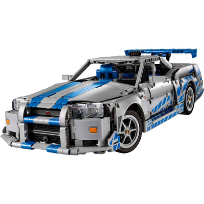 A gray and blue LEGO® 2 Fast 2 Furious Nissan Skyline GT-R (R34) car, viewed from the front left side.