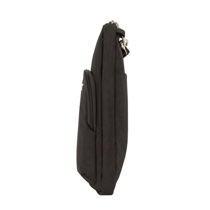 Side view of Travelon Anti-theft Essentials Mini Asymmetric Crossbody in black, featuring a small outer pocket.