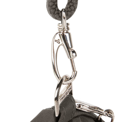 Close-up of a silver carabiner on the Travelon Anti-theft Essentials Mini Asymmetric Crossbody attaching the strap.