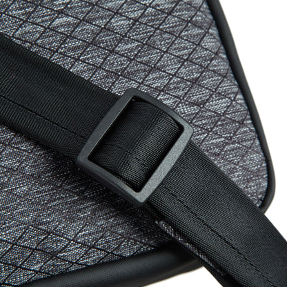 Close up of black adjustable crossbody strap