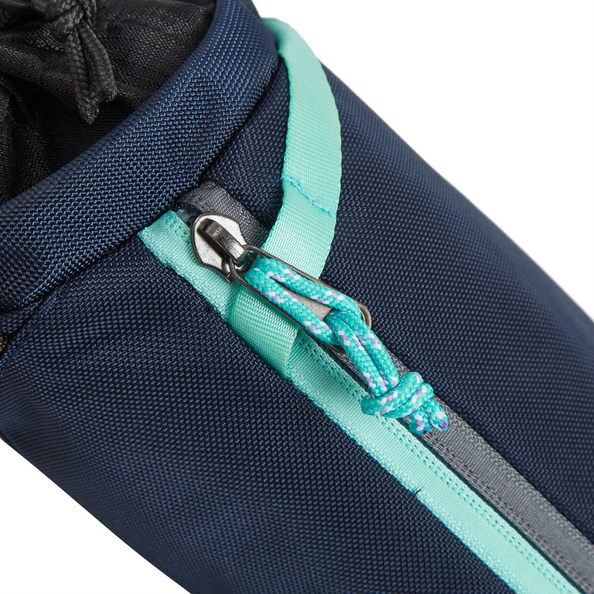 Close-up of the Travelon Greenlander bag in blue and teal, made from recycled materials with a teal drawstring.