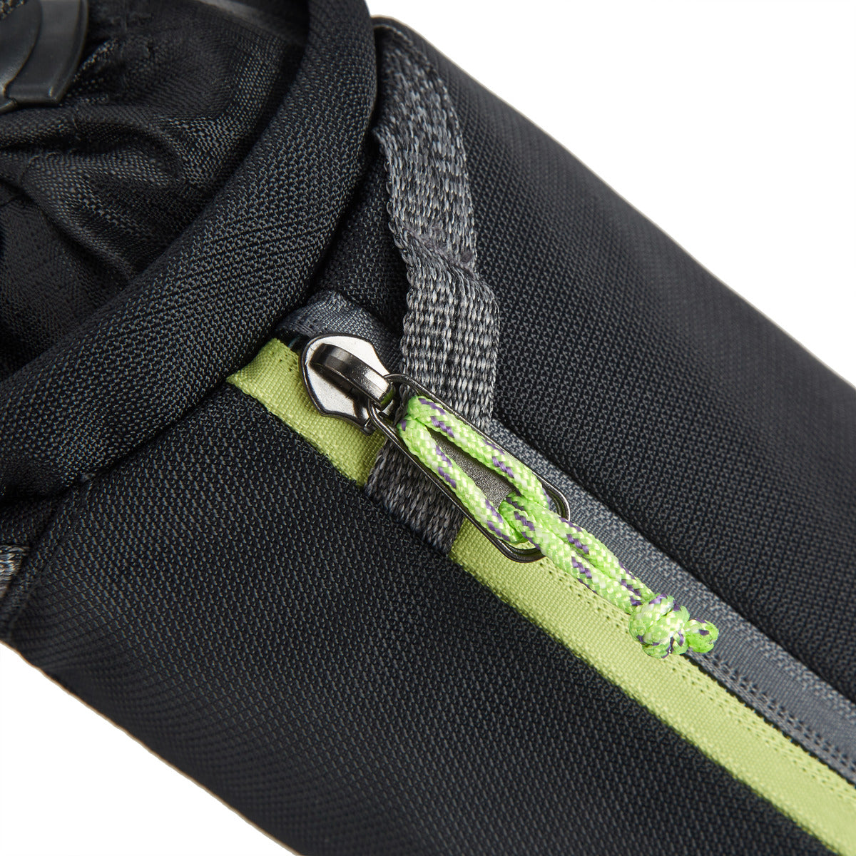 Travelon Anti-Theft Greenlander bottle bag, black with a green zipper pull and gray stitching.