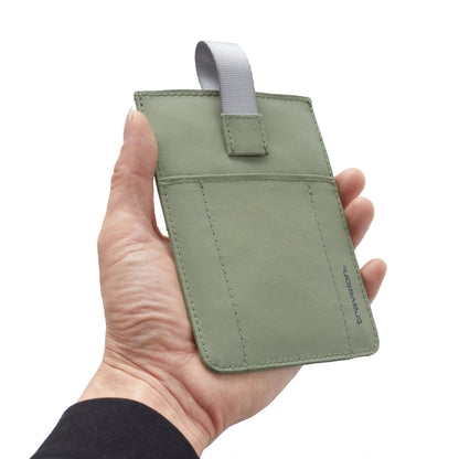 A hand holds the Travelon RFID Blocking Pull-Up Passport Holder with gray fabric loop and visible stitching.
