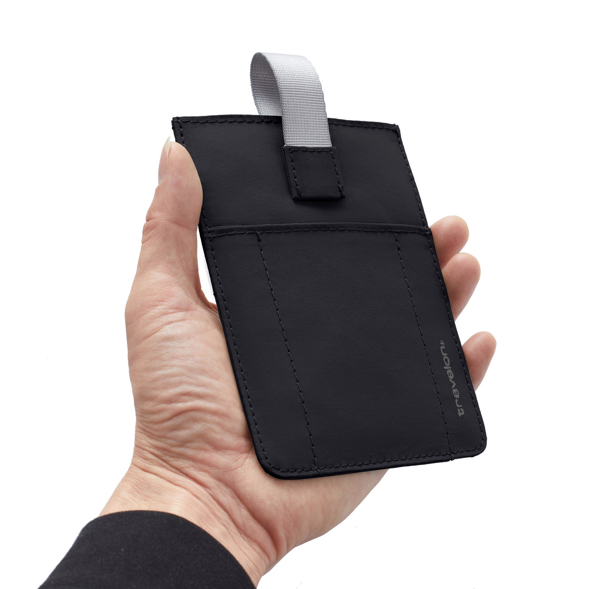 A hand holds the Travelon RFID Blocking Pull-Up Passport Holder with gray loop and visible stitching.
