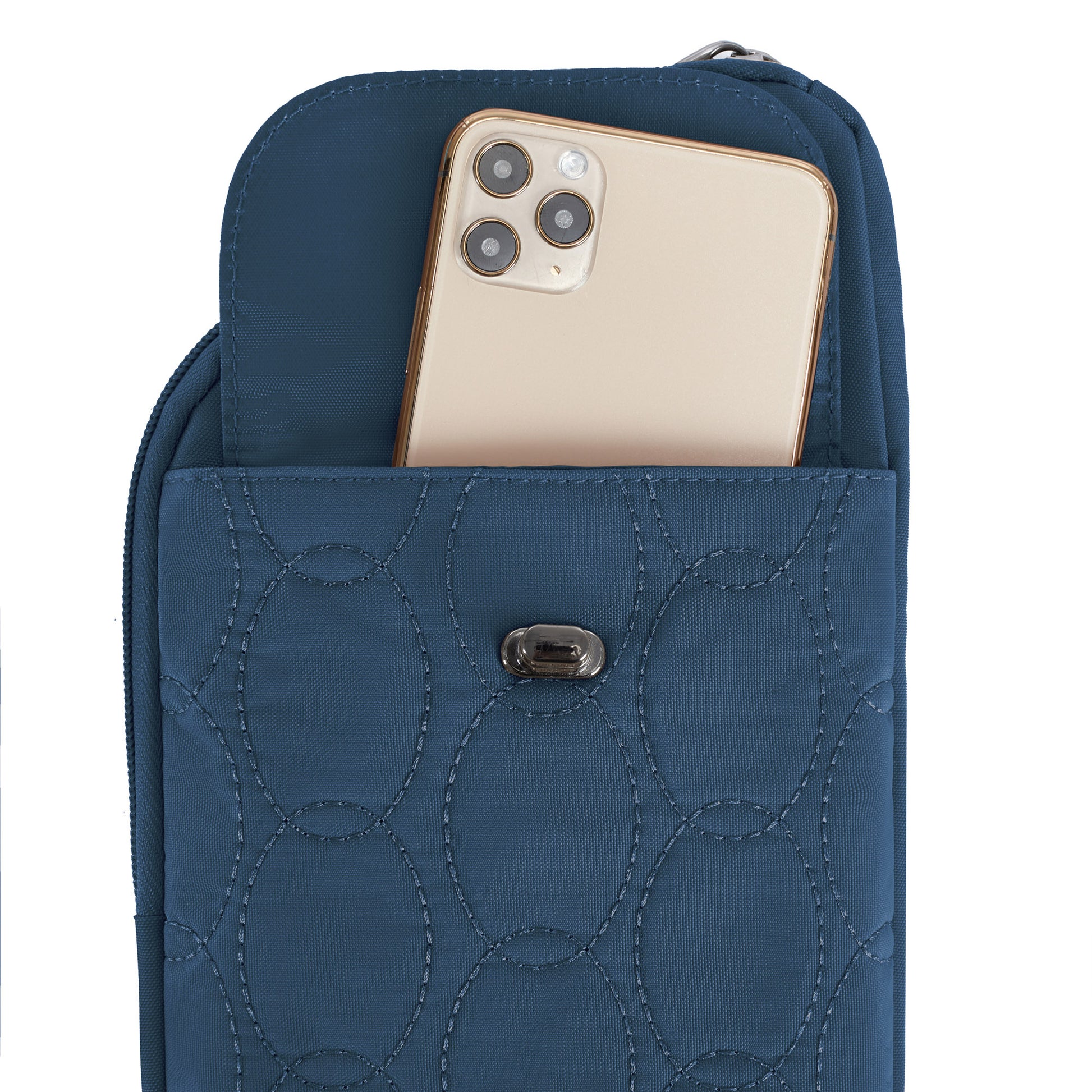 A gold smartphone is partially inserted into the front pocket of a Travelon Runways Slim Asymmetric Crossbody.
