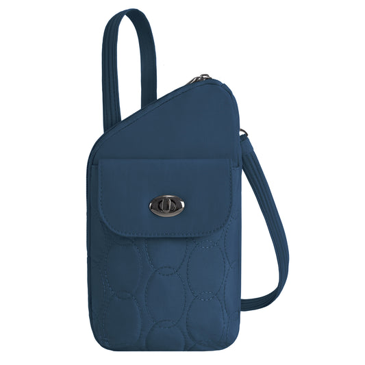 Product Image – Travelon Runways Anti-theft Slim Asymmetric Crossbody: blue quilted bag with flap pocket and twist lock.