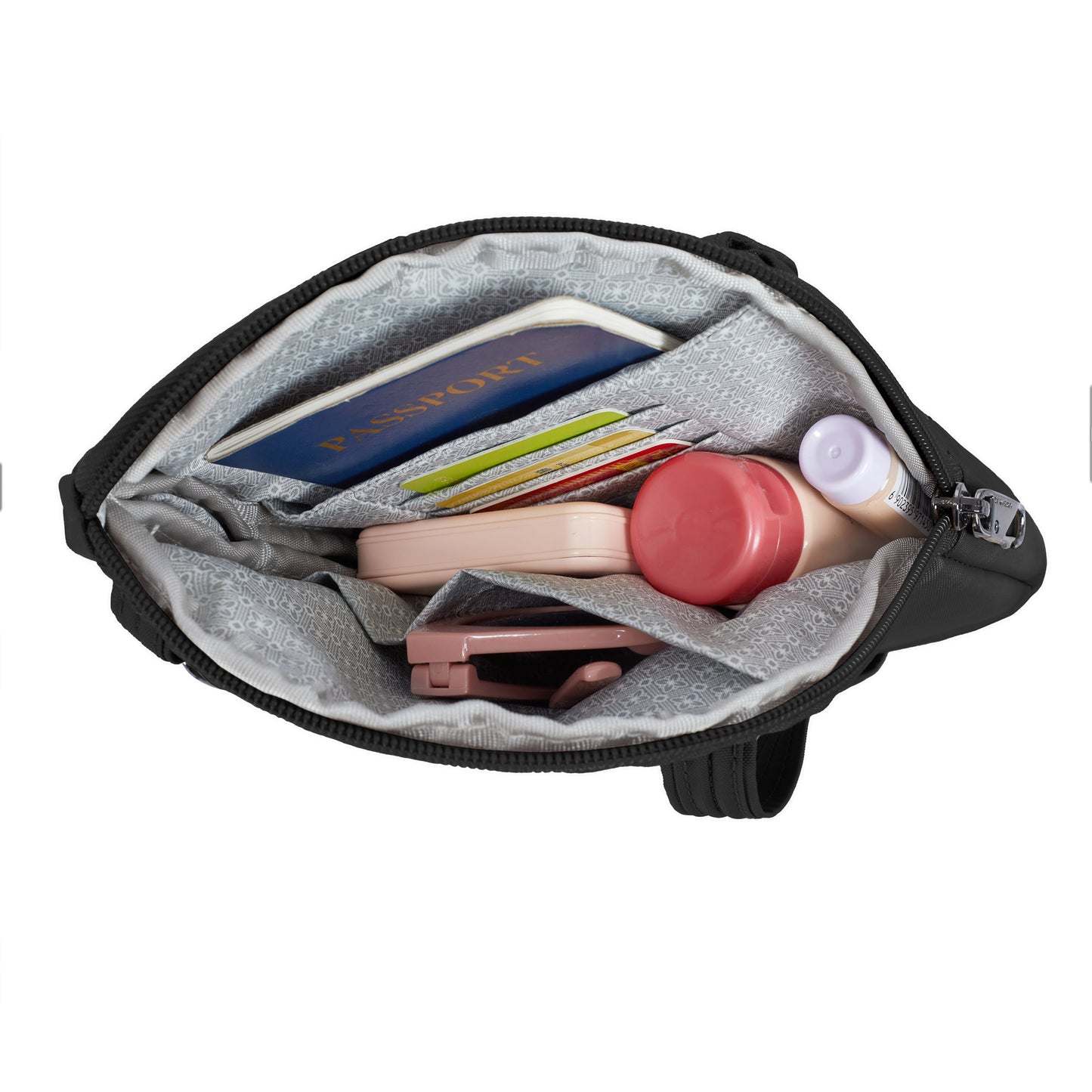 Open Travelon Runways Crossbody displaying a passport, cards, cosmetics, and items neatly arranged inside.