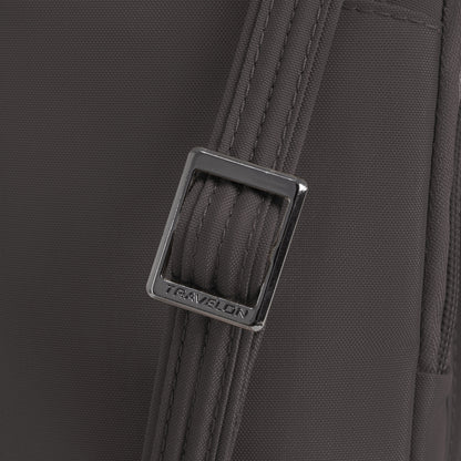 Close-up of the gray strap on the Travelon Runways Anti-theft Slim Asymmetric Crossbody with a silver buckle.