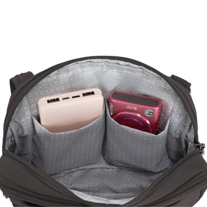 Open Travelon Runways Crossbody to reveal two inner pockets with a pink power bank and red digital camera.