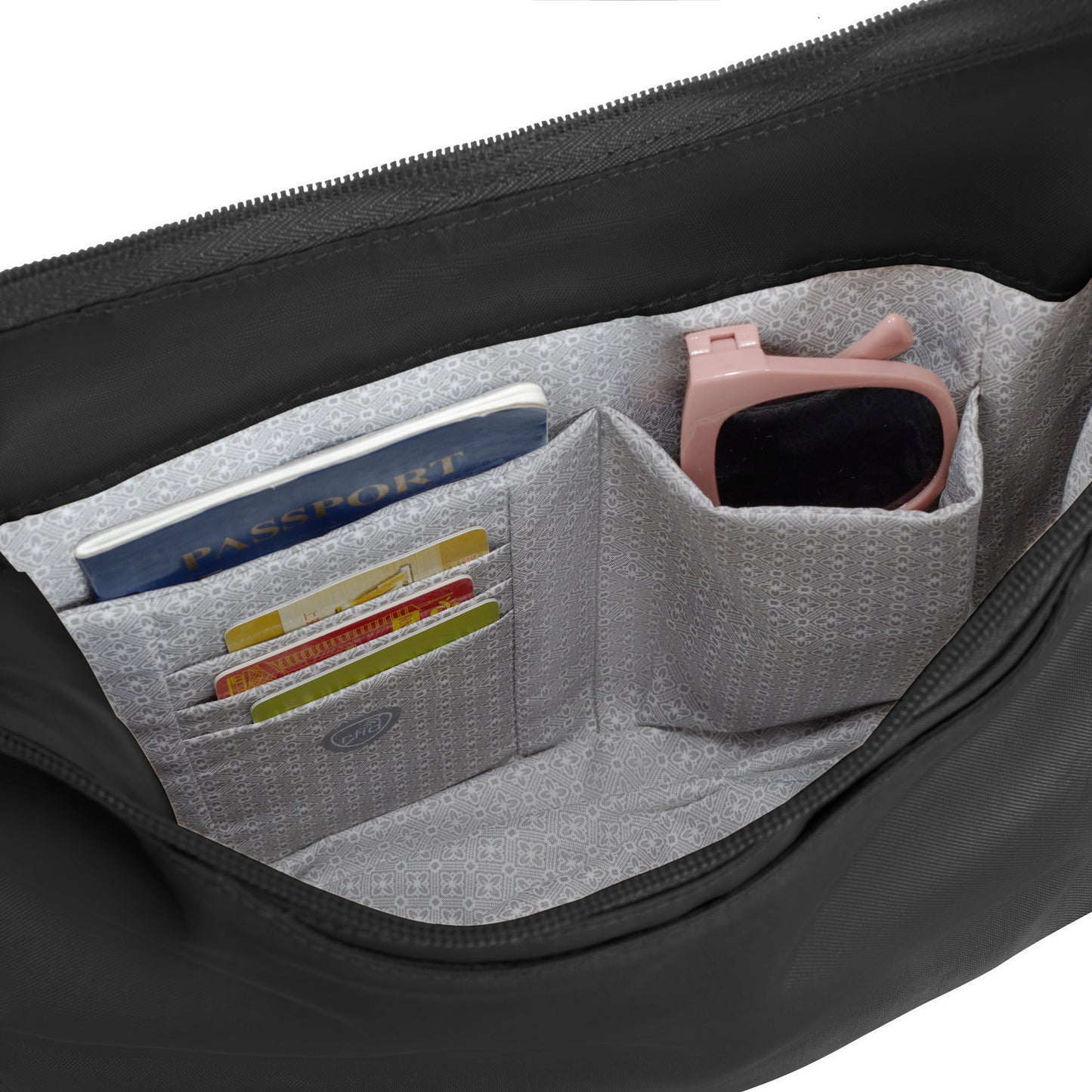 Interior of the Travelon Runways Anti-theft Medium Crossbody with pockets for passport, cards, and sunglasses.