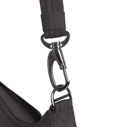 Close-up of a metal clasp attaching a black strap to the Travelon Runways Anti-theft Medium Crossbody bag.