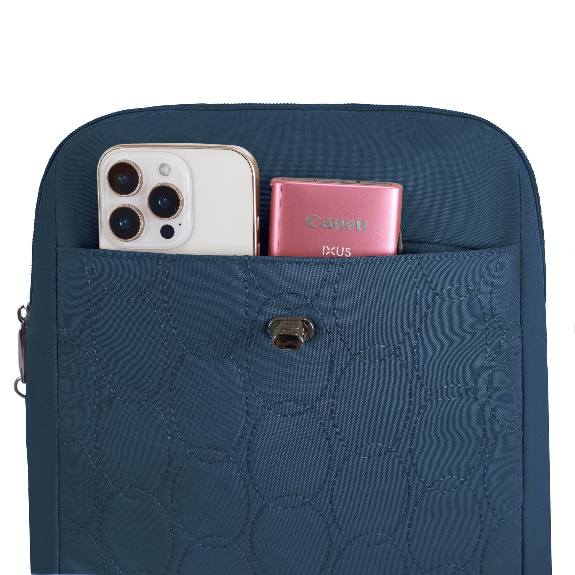 A chic blue Travelon Runways Anti-theft Compact Backpack with a smartphone and pink camera in front pocket.