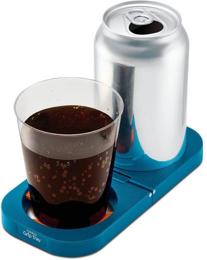 The Go Travel Folding Grip Tray secures a soda can and cup to prevent slipping.