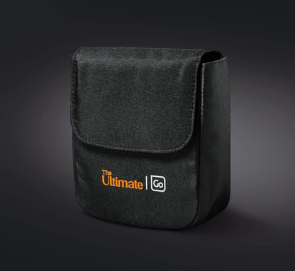 Black fabric pouch with flap for your Go Travel The Ultimate Eye Mask, featuring the brand’s orange-white logo.