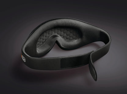 Go Travel The Ultimate Eye Mask by Go Travel with adjustable Velcro strap shown on a dark background.