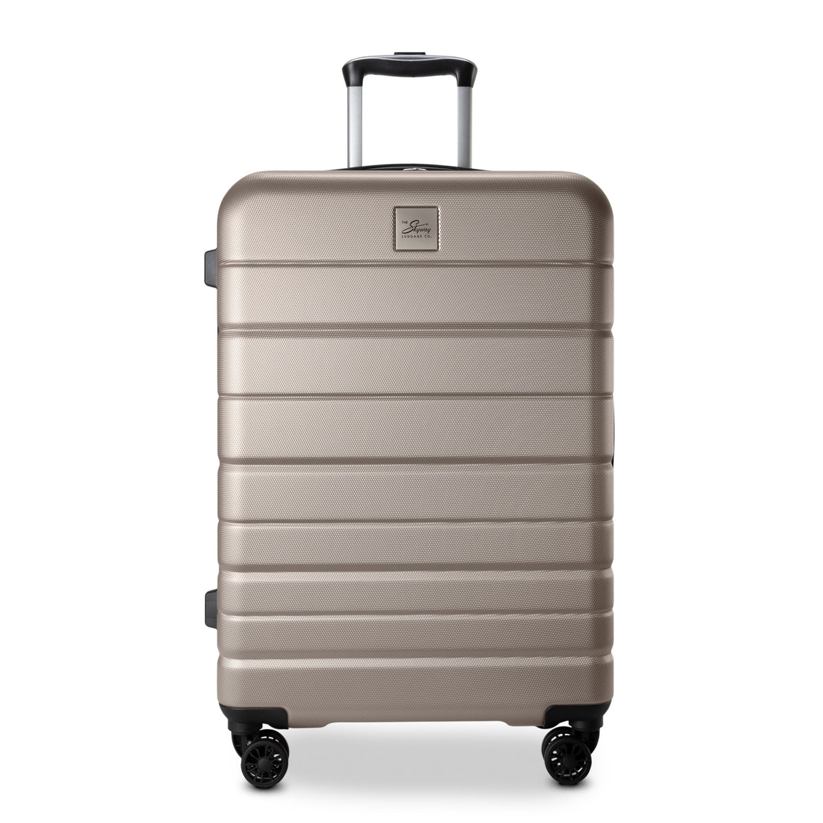 Skyway Epic 2.0 Hardside Medium Check-in Spinner stands upright, light brown with 4 wheels and retractable handle.