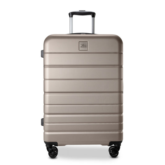 Product Image – Skyway Epic 2.0 Hardside Medium Check-in Spinner stands upright, light brown with 4 wheels and retractable handle.
