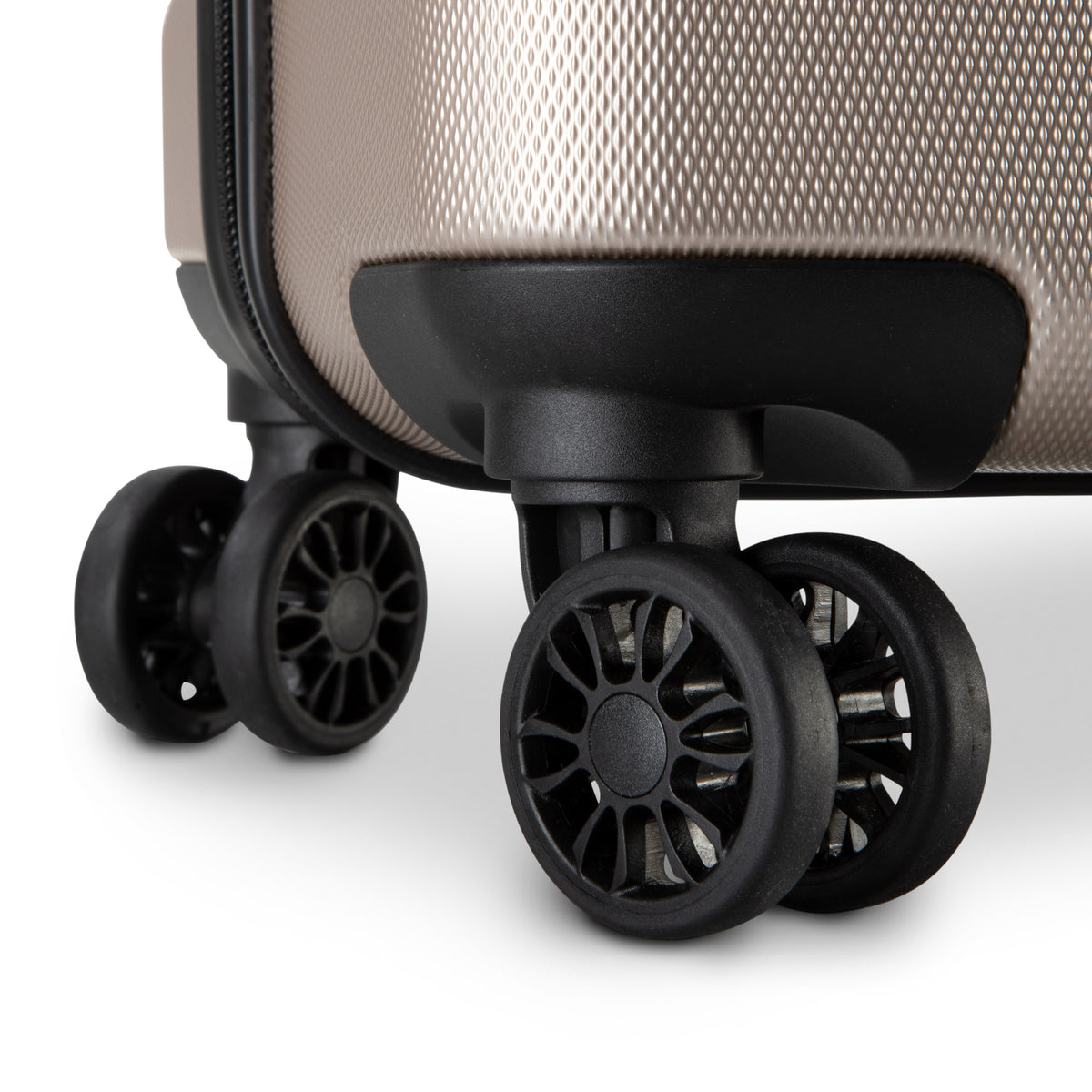 Close-up of black double spinner wheels on Skyway Epic 2.0 Hardside Medium Check-in Spinner by Skyway.