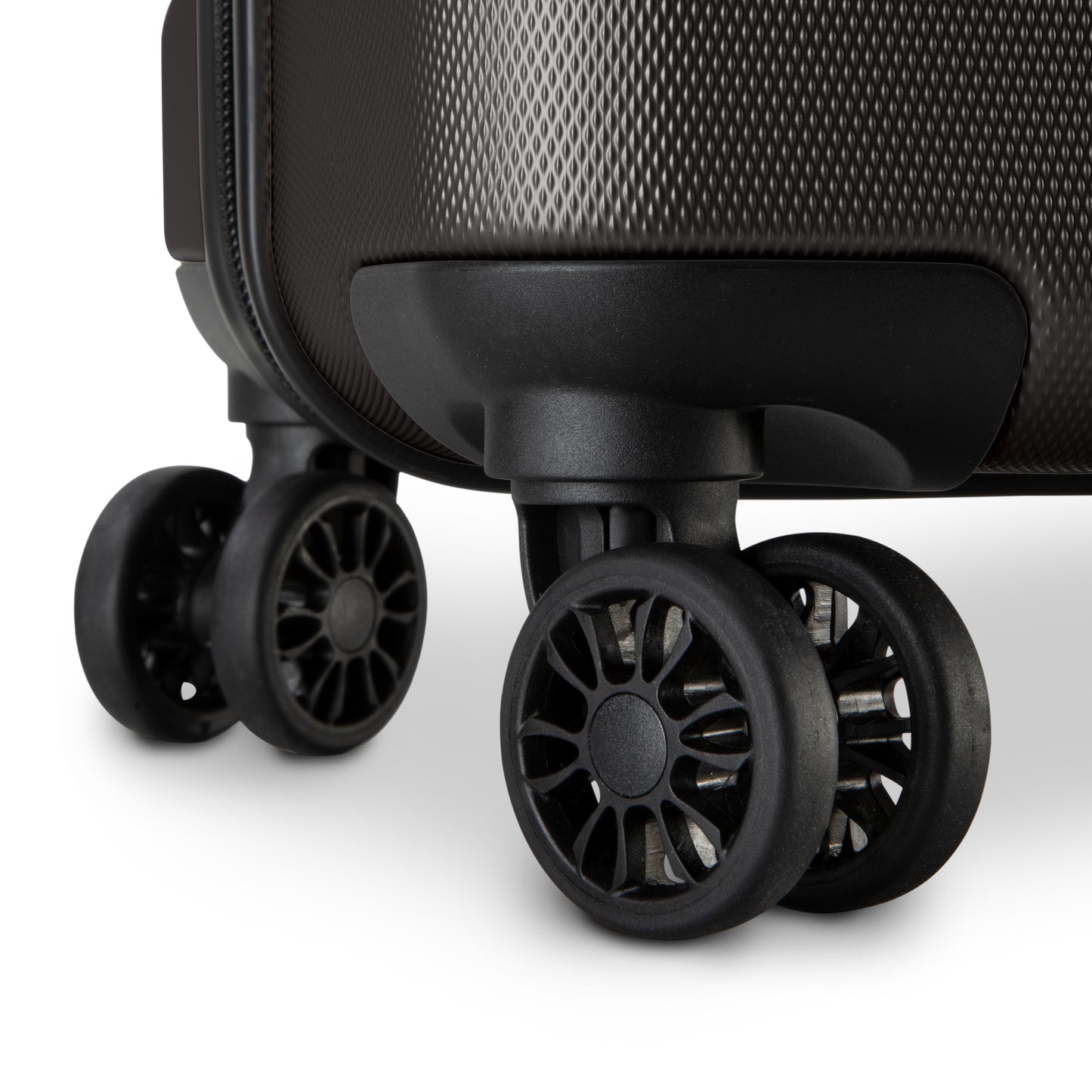 Close-up of 360° dual wheels and textured corner on the Skyway Epic 2.0 Hardside Luggage Set.