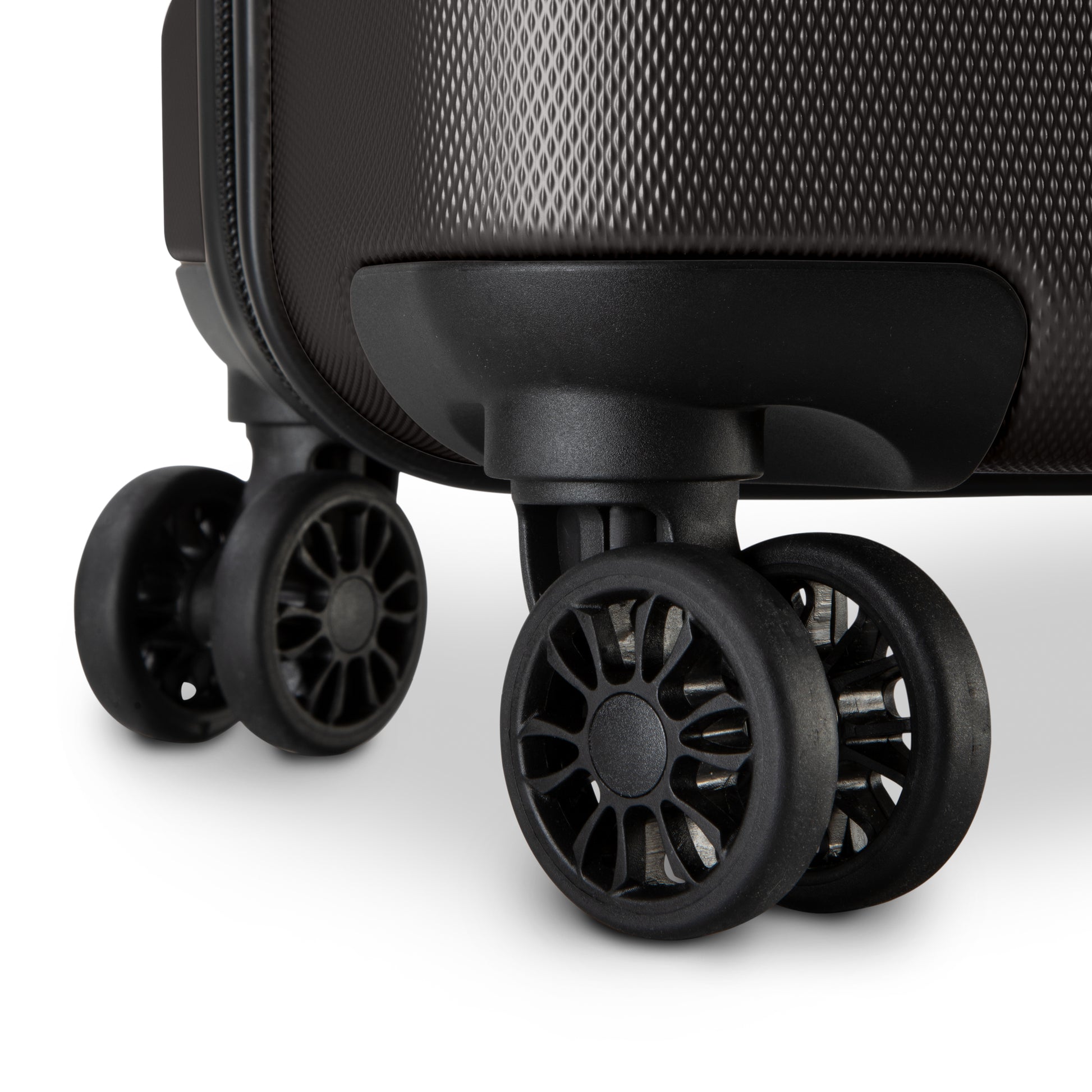 Close-up of 360° dual wheels and textured corner on the Skyway Epic 2.0 Hardside Luggage Set.