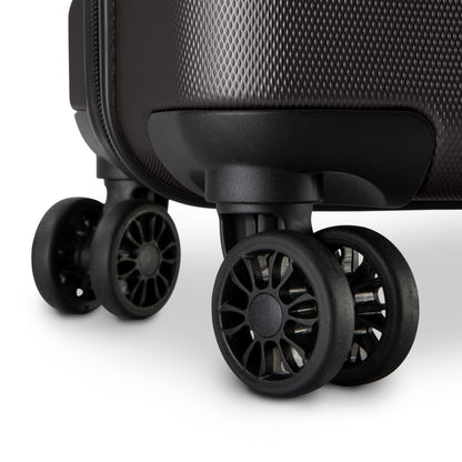 Close-up of 360° dual wheels and textured corner on the Skyway Epic 2.0 Hardside Luggage Set.