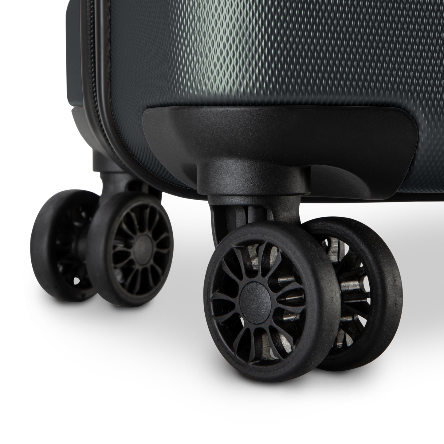 Close-up of scratch-resistant 360° dual wheels on the Skyway Epic 2.0 Hardside Luggage Set against white.