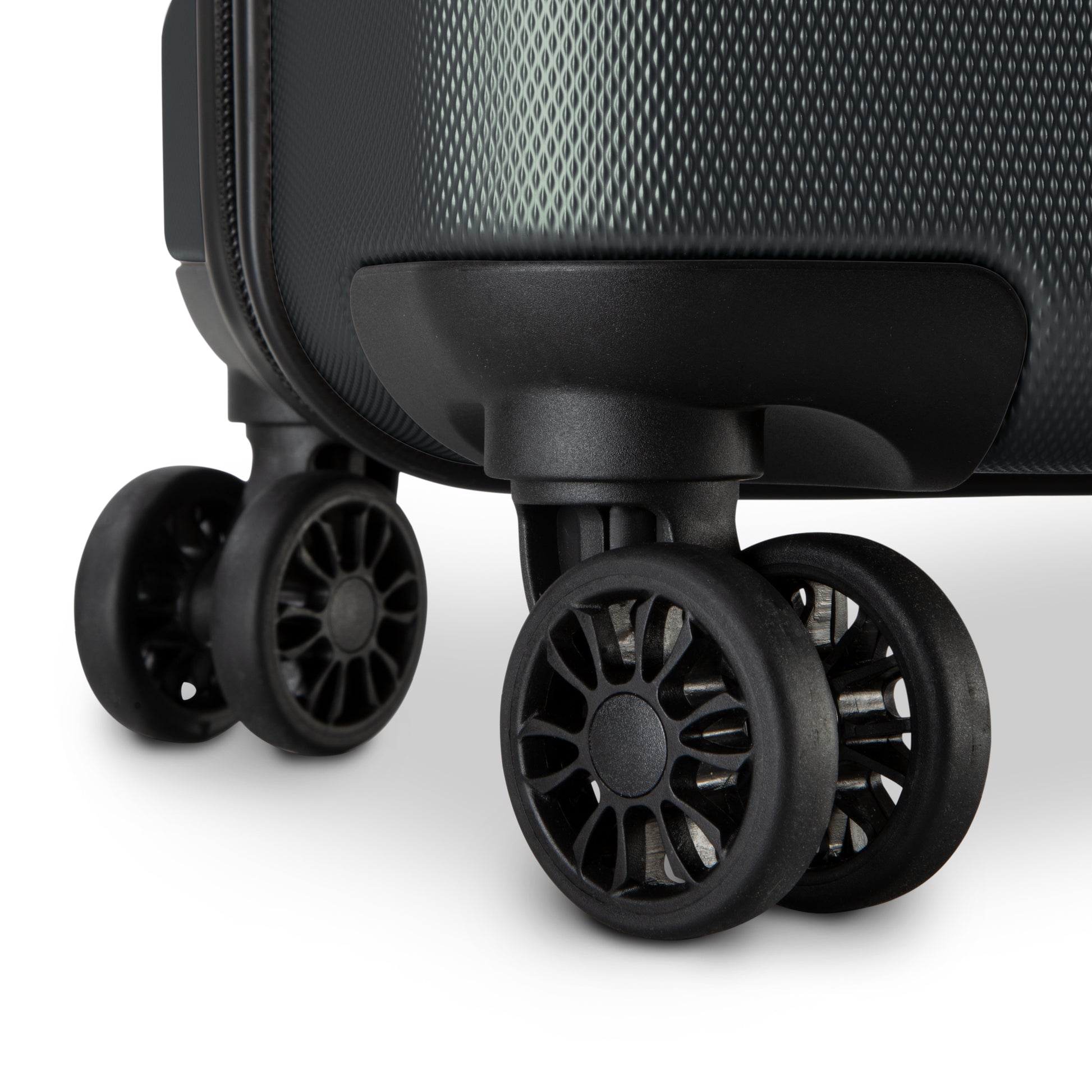 Close-up of scratch-resistant 360° dual wheels on the Skyway Epic 2.0 Hardside Luggage Set against white.