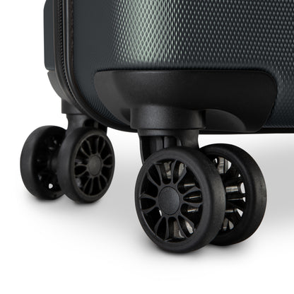 Close-up of scratch-resistant 360° dual wheels on the Skyway Epic 2.0 Hardside Luggage Set against white.