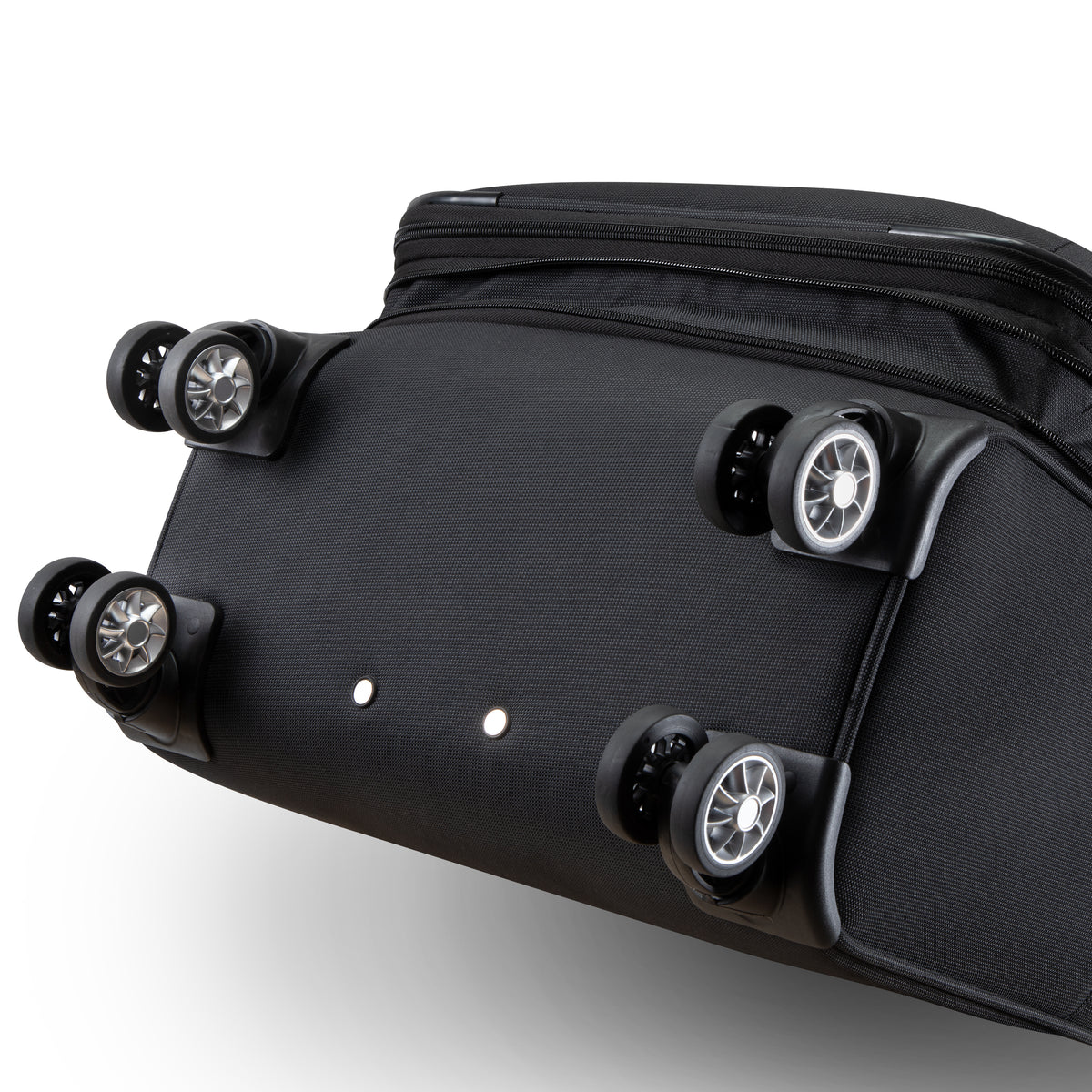 Bottom view of a black Skyway Flair 2.0 3-Piece Luggage Set expandable suitcase showing four double-spinner wheels.