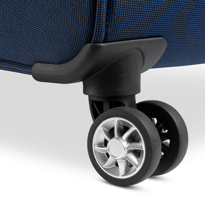 Close-up of a blue spinner wheel assembly on a Skyway Flair 2.0 3-Piece Luggage Set.