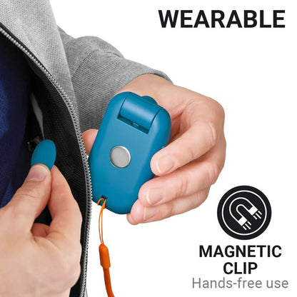 Person clips the Go Travel Floodlight Wearable Torch to their jacket for hands-free lighting.