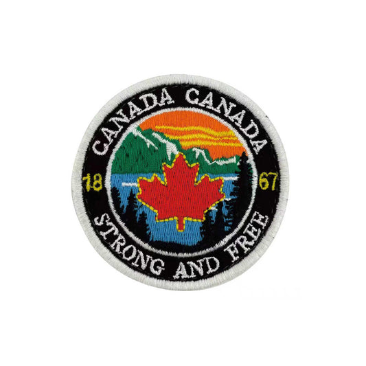 Product Image – Northern Icons Canada Round Iron-on Patch with maple leaf, mountains, forest, sunset, and “Canada Strong and Free.”.