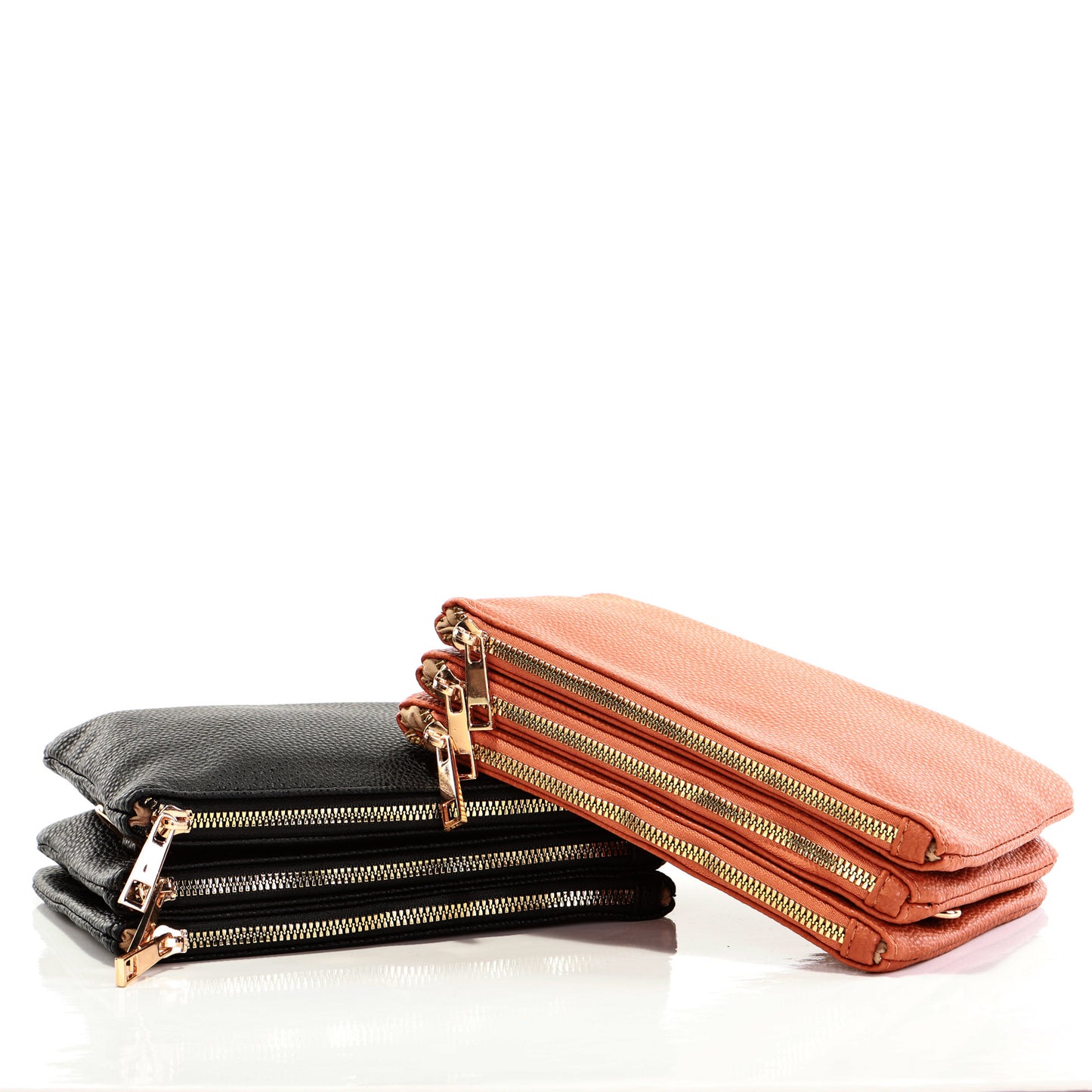 Alina's Triple Zip RFID Crossbody/Wristlet in black and tan, laying flat with tan slightly on top of black one, both with zippers showing