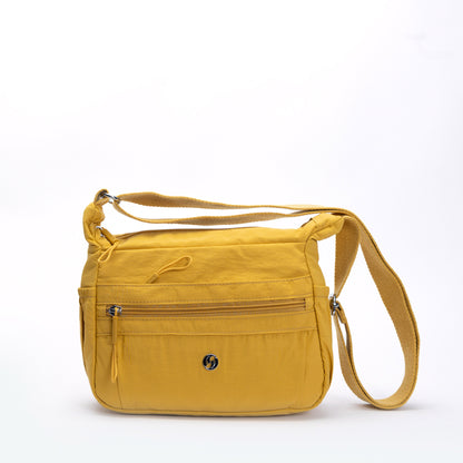 Miss Caprice Multi-zip Small Hobo Crossbody in yellow, with multi pockets and adjustable strap on white background.